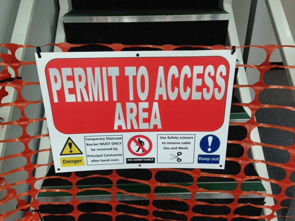 permit to access area sign and barrier